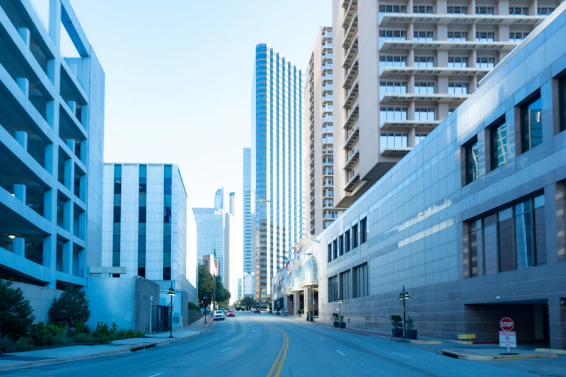 a city street lined with tall buildings next to each other