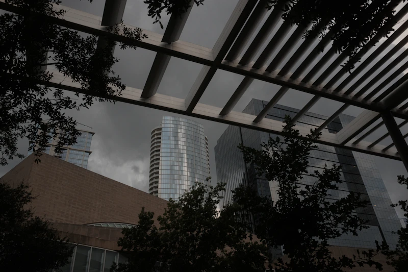 Modern building with glass facade and rooftop structure above