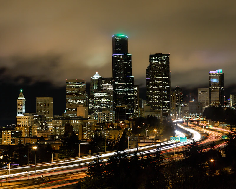 Seattle's skyline glows brightly at night.