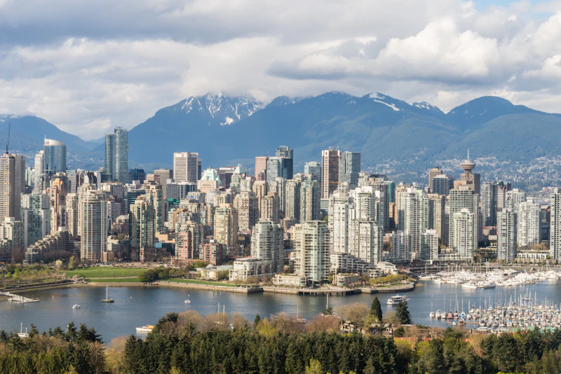 A view of a city with mountains in the background