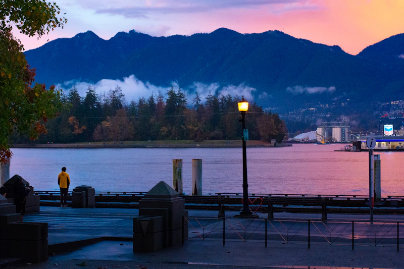 A view of a lake with mountains in the background